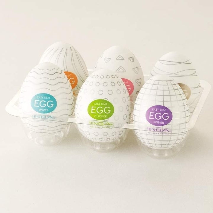 The six strokers in egg-shaped packaging, in a carton