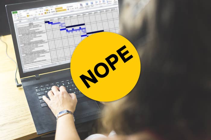Woman making a spreadsheet on a laptop with a sticker that says "nope" on it