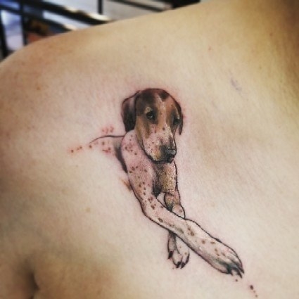 A shoulder tattoo of someone&#x27;s dog