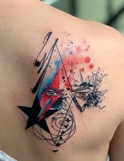 A shoulder tattoo of David Bowie&#x27;s face