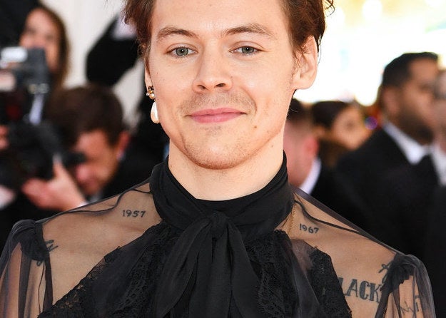 Harry Styles grinning