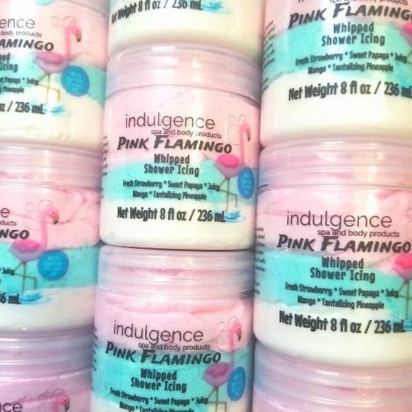 Jars of the whipped shower icing in a fresh strawberry, sweet papaya, juicy mango, and tantalizing pineapple scent in pink, blue, and white