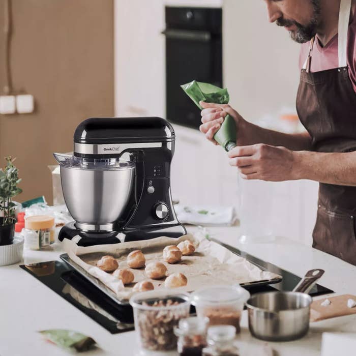 Person is baking next to a stand mixer
