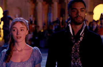 Daphne and Simon entering a ball