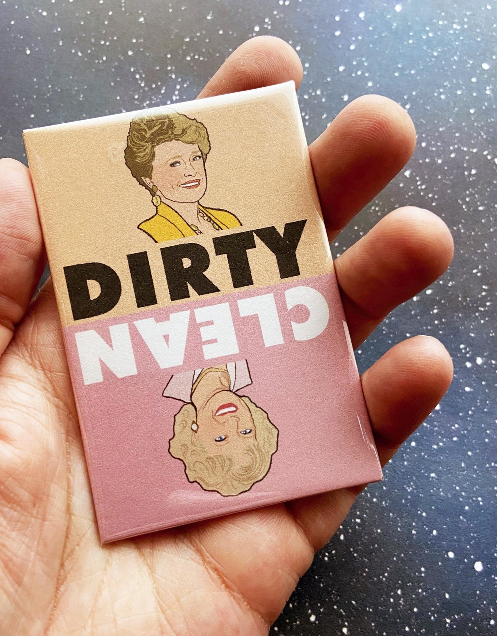 a person holding the magnet with blanche on the dirty side and rose on the clean side