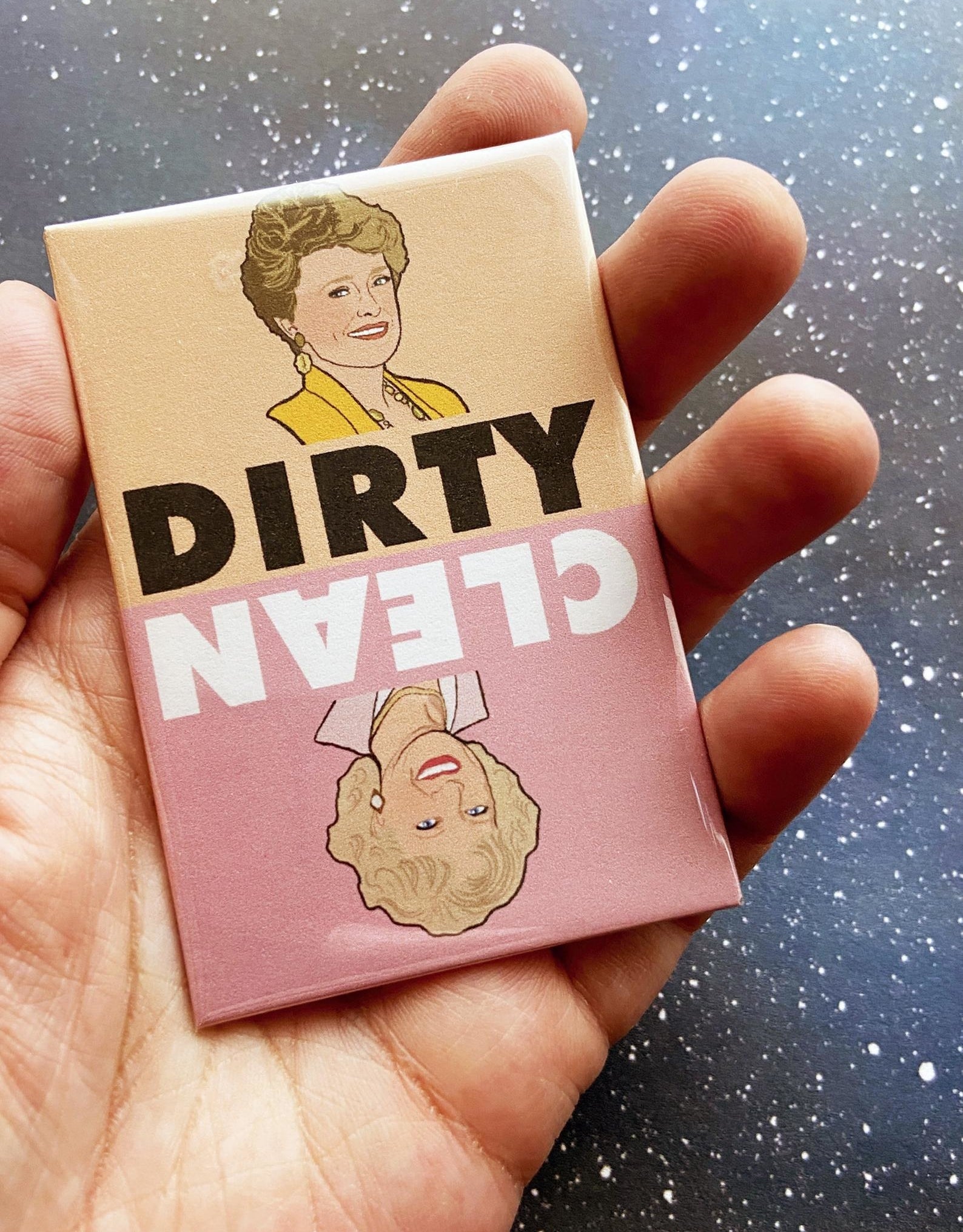 a person holding the magnet with blanche on the dirty side and rose on the clean side