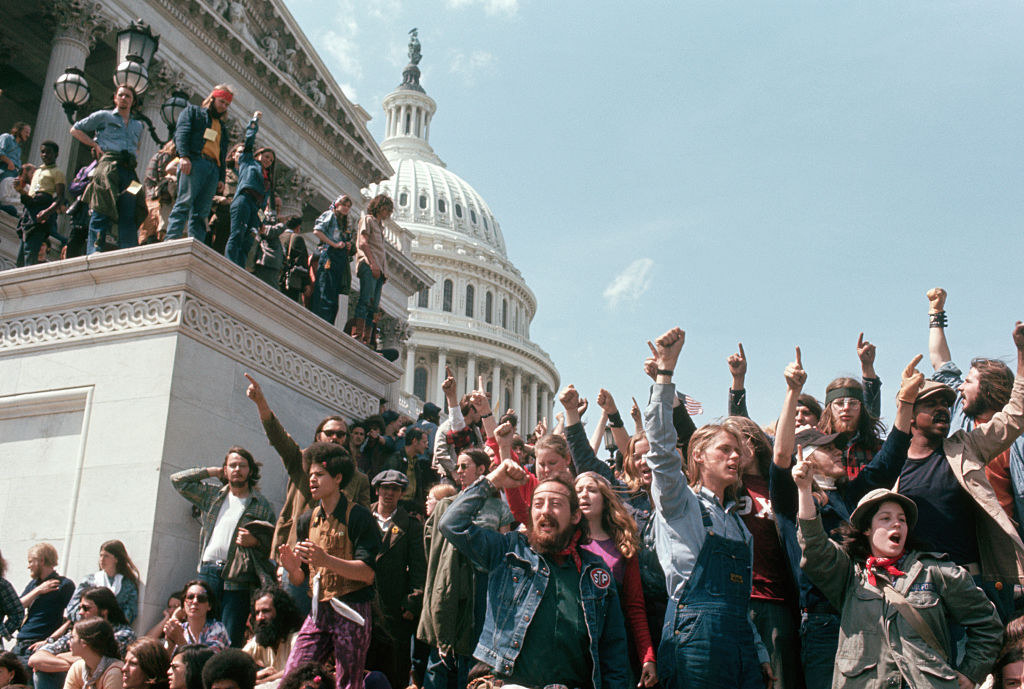 Protestors cheering their blocking of the main entrance to the House of Representatives