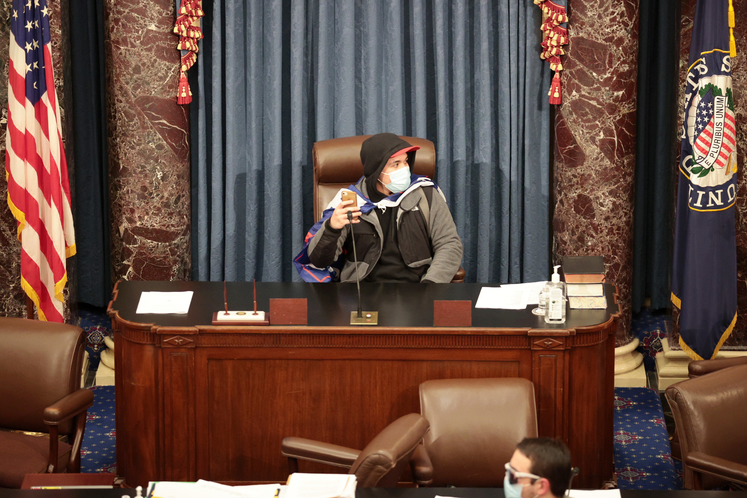 A Trump supporting sitting in the Senate Chamber