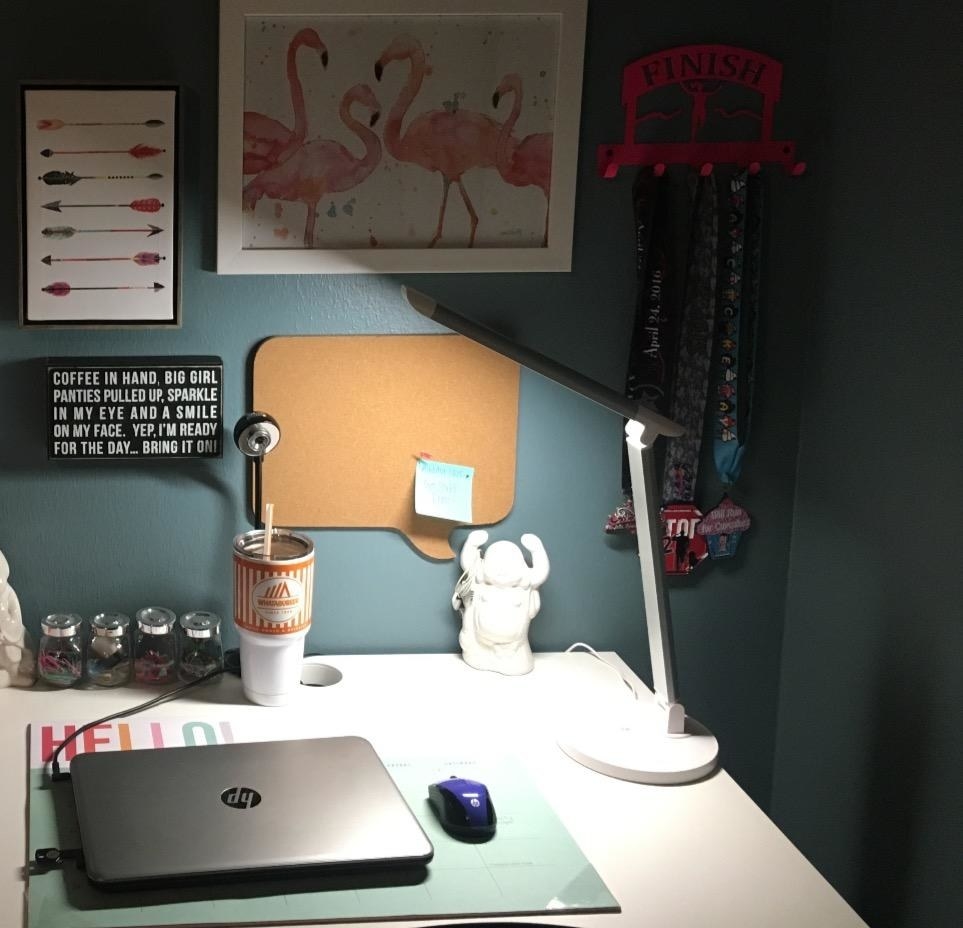 reviewer&#x27;s desk lamp providing bright light on their desk area 