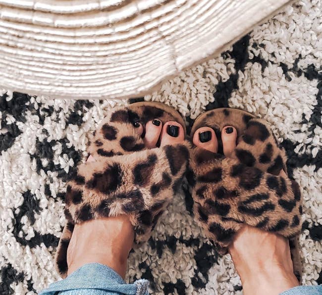 reviewer wearing leopard slippers 