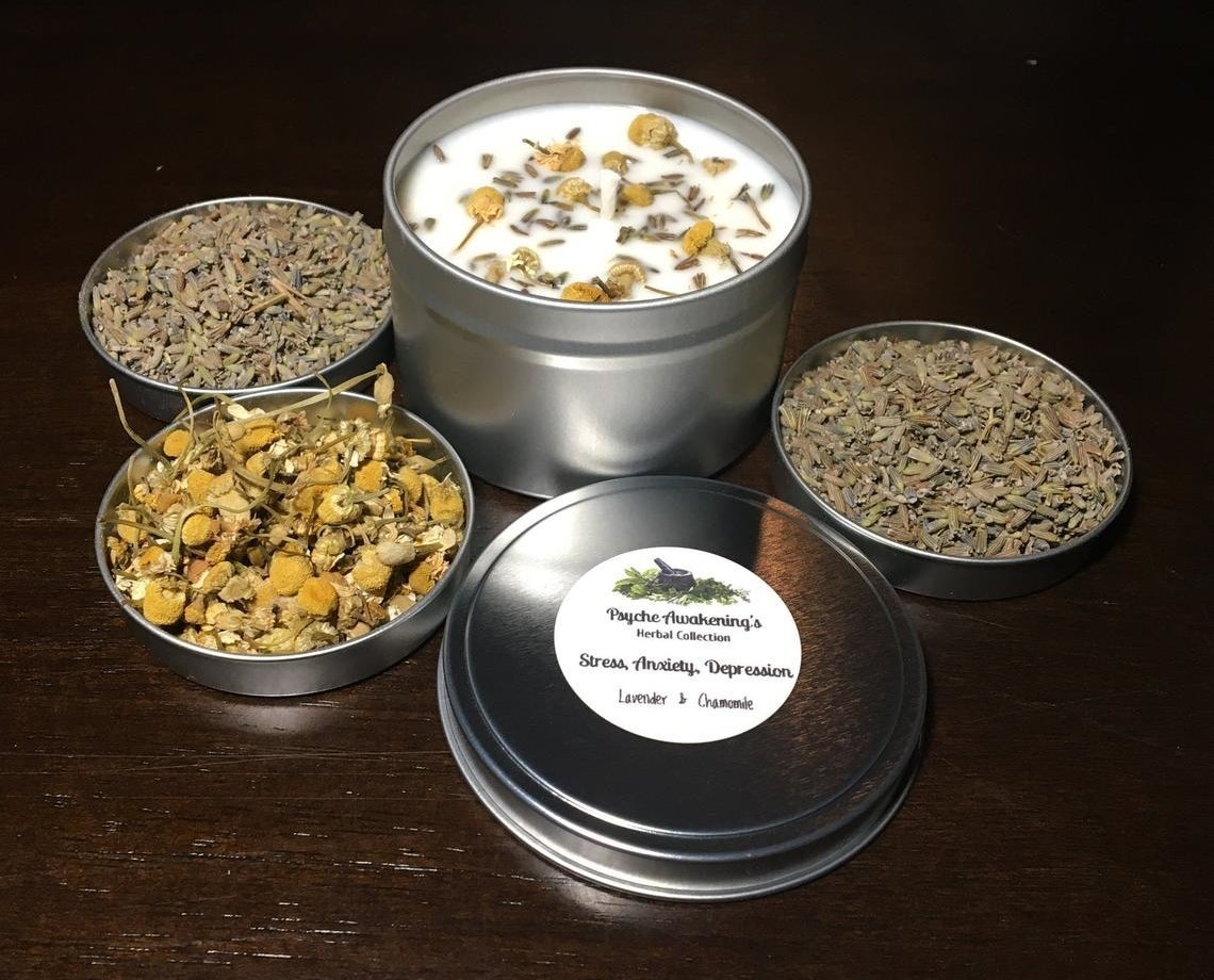 photo showing candle surrounded by natural lavender and chamomile 