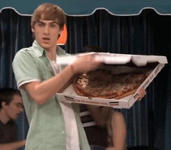 Kendall from &quot;Big Time Rush&quot; gesturing to a heart-shaped pizza