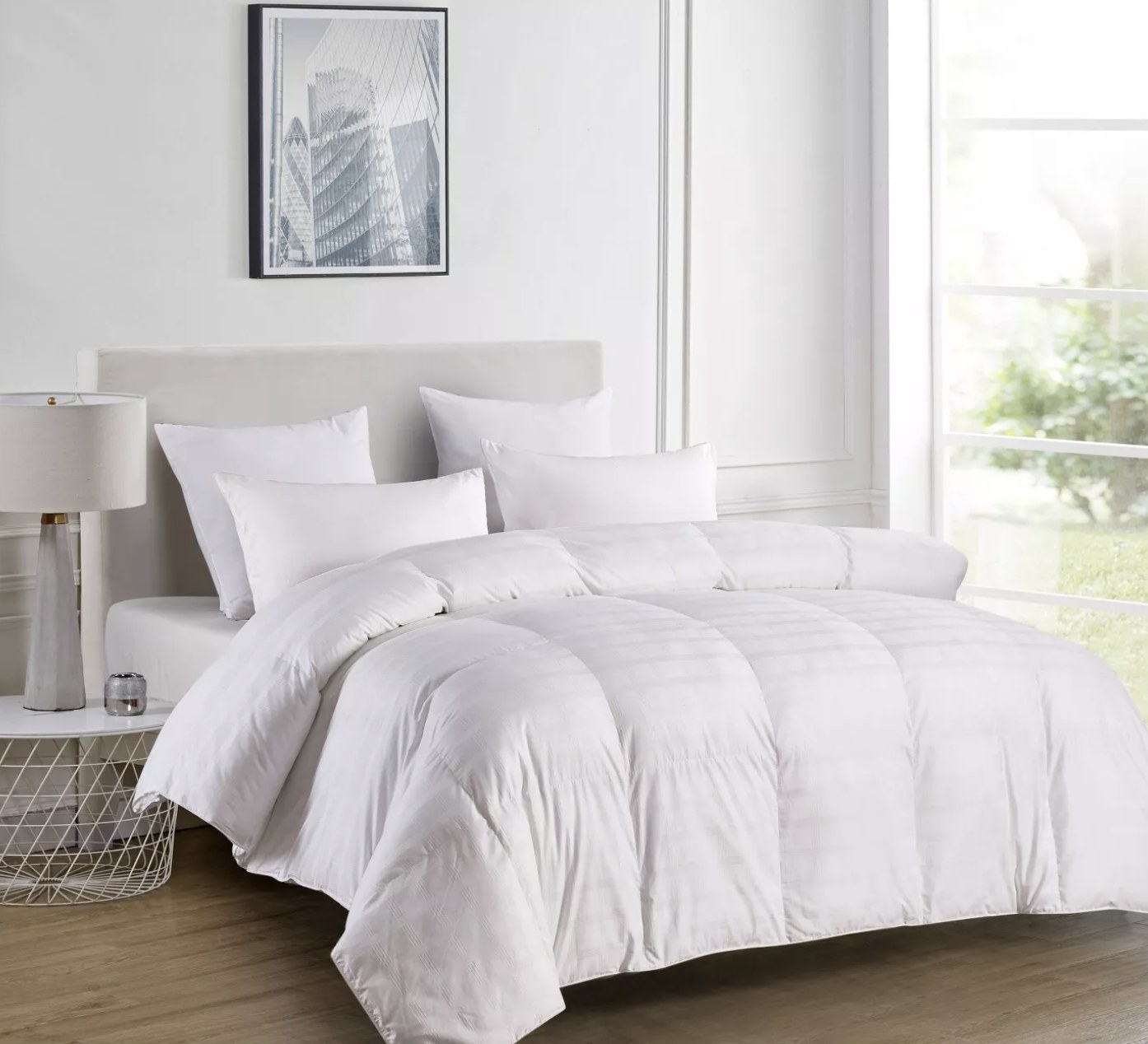 the comforter in white on a bed 