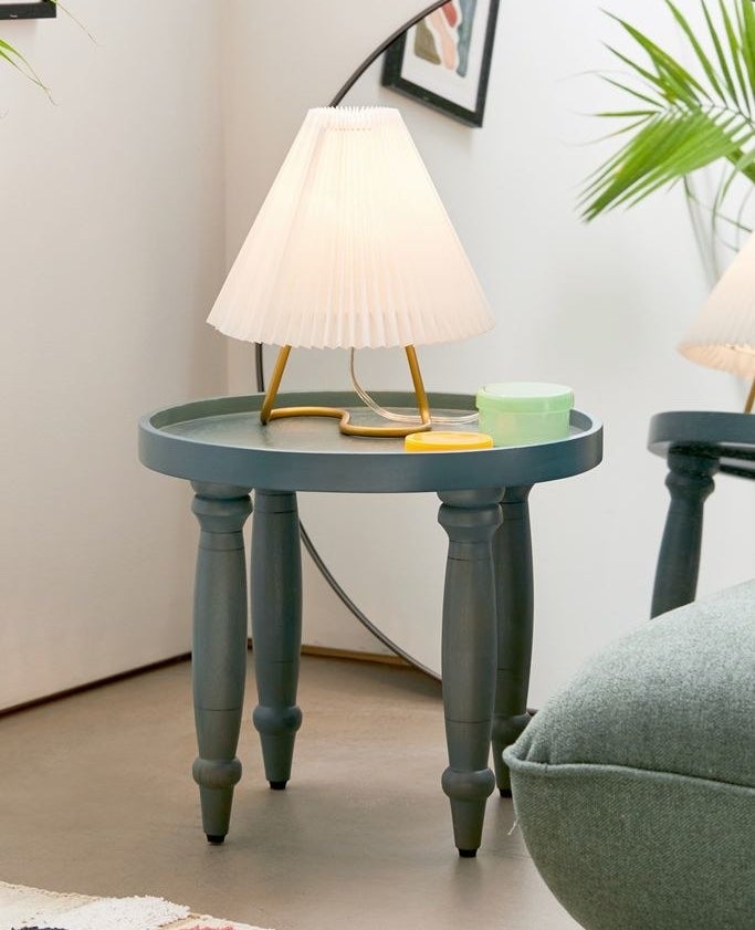 The four-legged blue side table