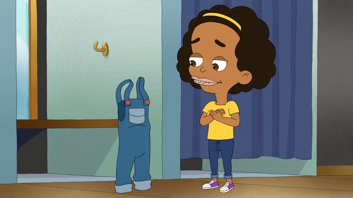 Missy from Big Mouth looking at a pair of overalls