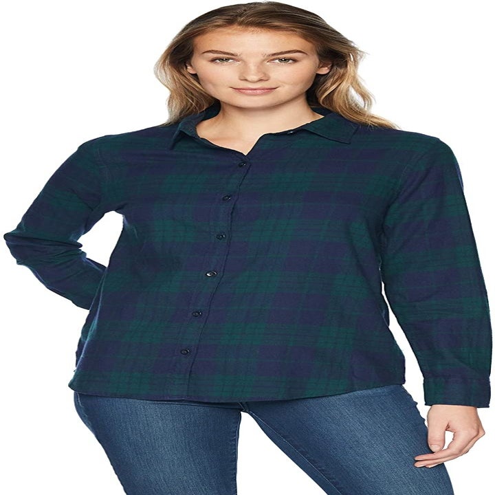 a model wearing a blue and green plaid flannel