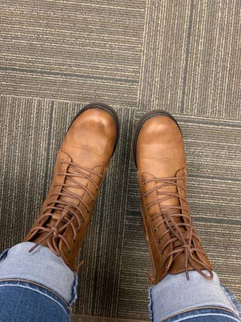 a reviewer wearing the boots in tan
