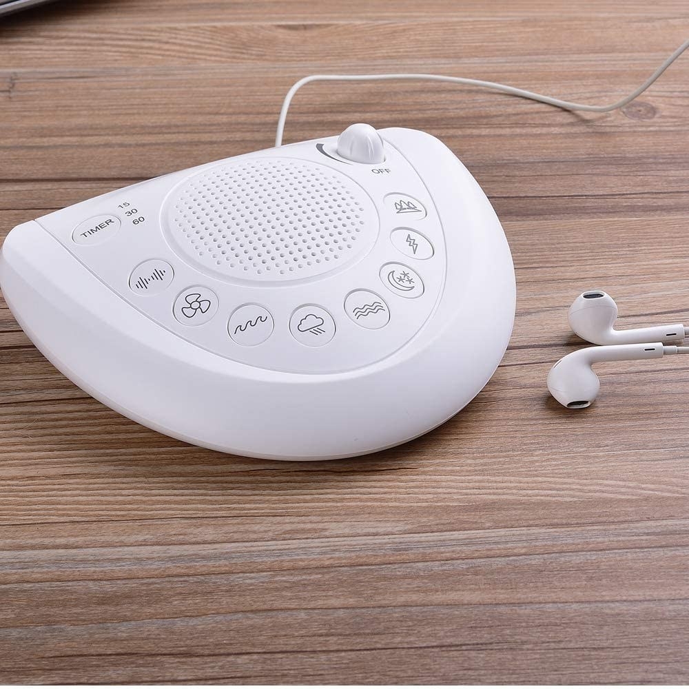 the white noise machine with buttons that indicate the sound like a wave and a fan