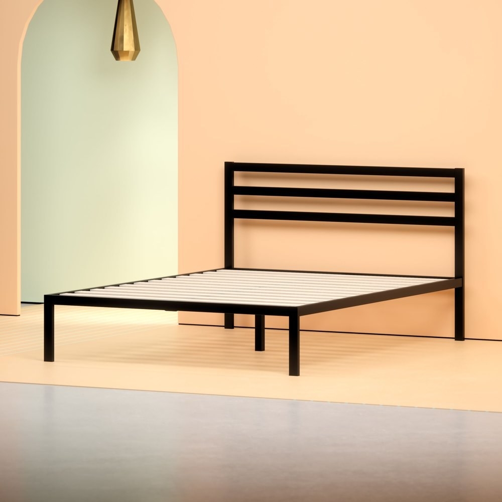 a black metal platform bed with a black metal headboard in a modermn, angular design in a bedroom