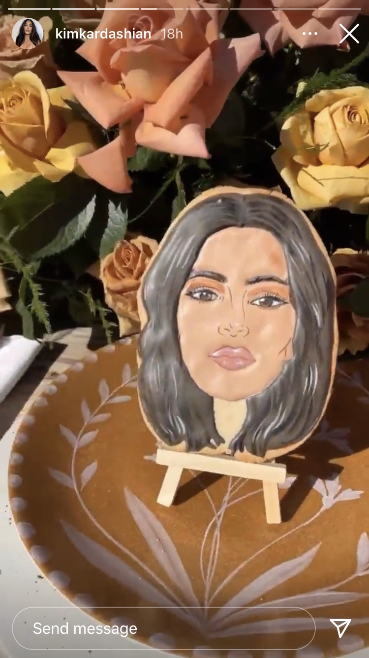 Kim Kardashian Instagram story of a cookie with their faces