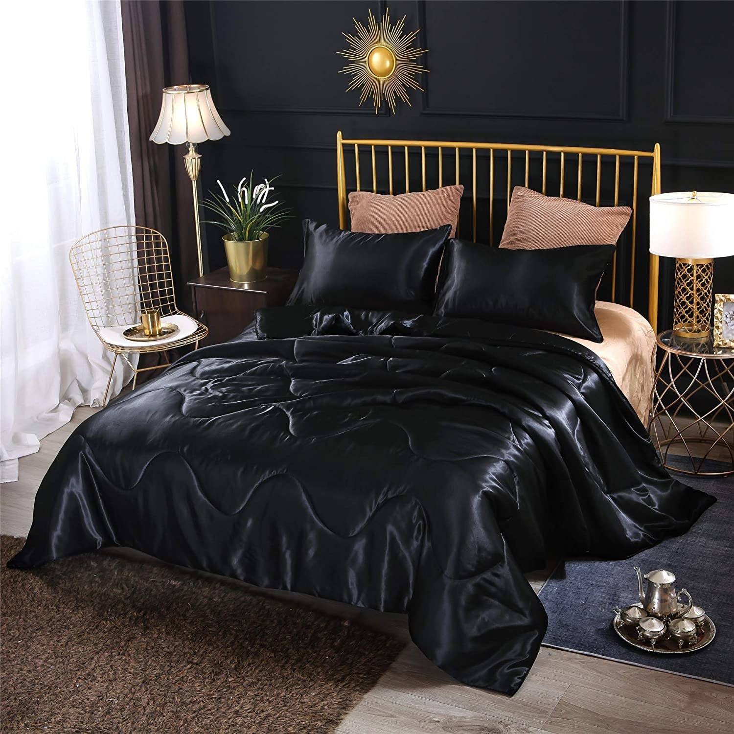 Black comforter on mattress in bedroom