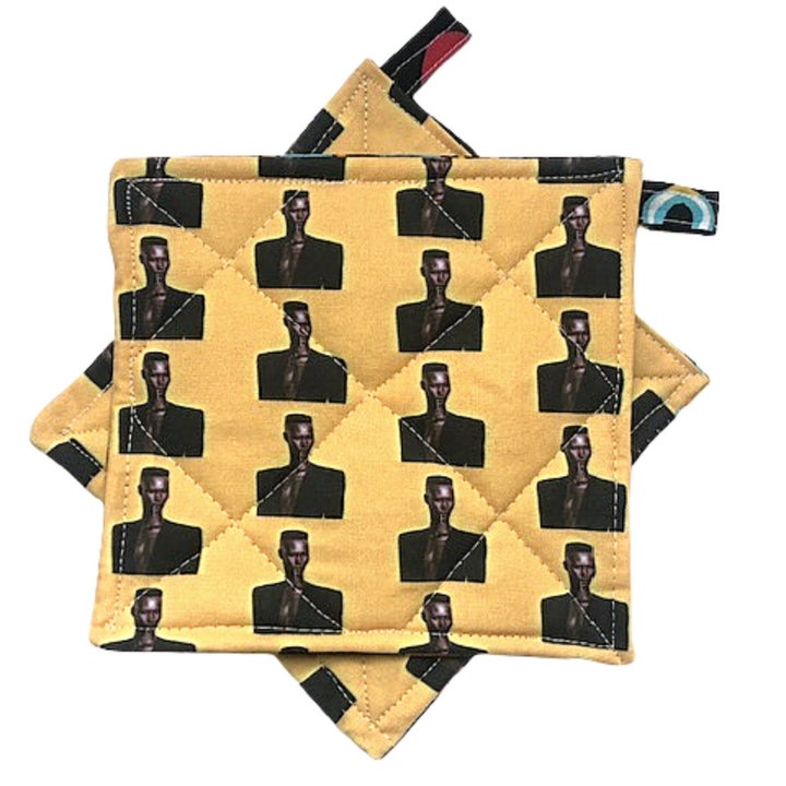 yellow potholders with grace jones' face all over them 