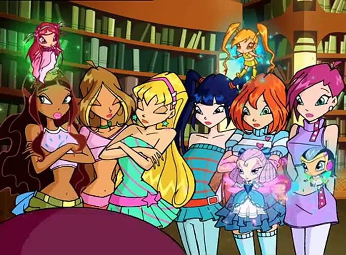 Left to right: Aisha, Flora, Stella, Musa, Bloom, Tecna and their pixies in the Winx Club cartoon