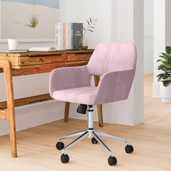 Blush desk chair with chrome frame and black wheels