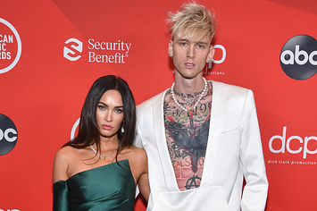 Megan and MGK posing on the red carpet together