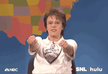 A gif of Kate McKinnon dressed like a middle-aged mom, pretending to drive a car