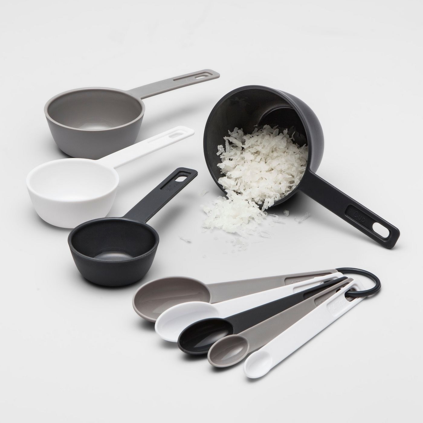 A black, white and grey measuring set