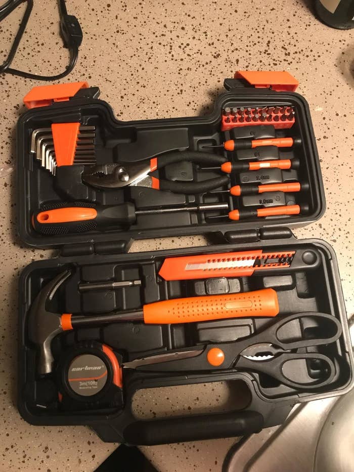 A reviewer photo showing the open case of the 39-piece toolkit filled with orange and black tools 