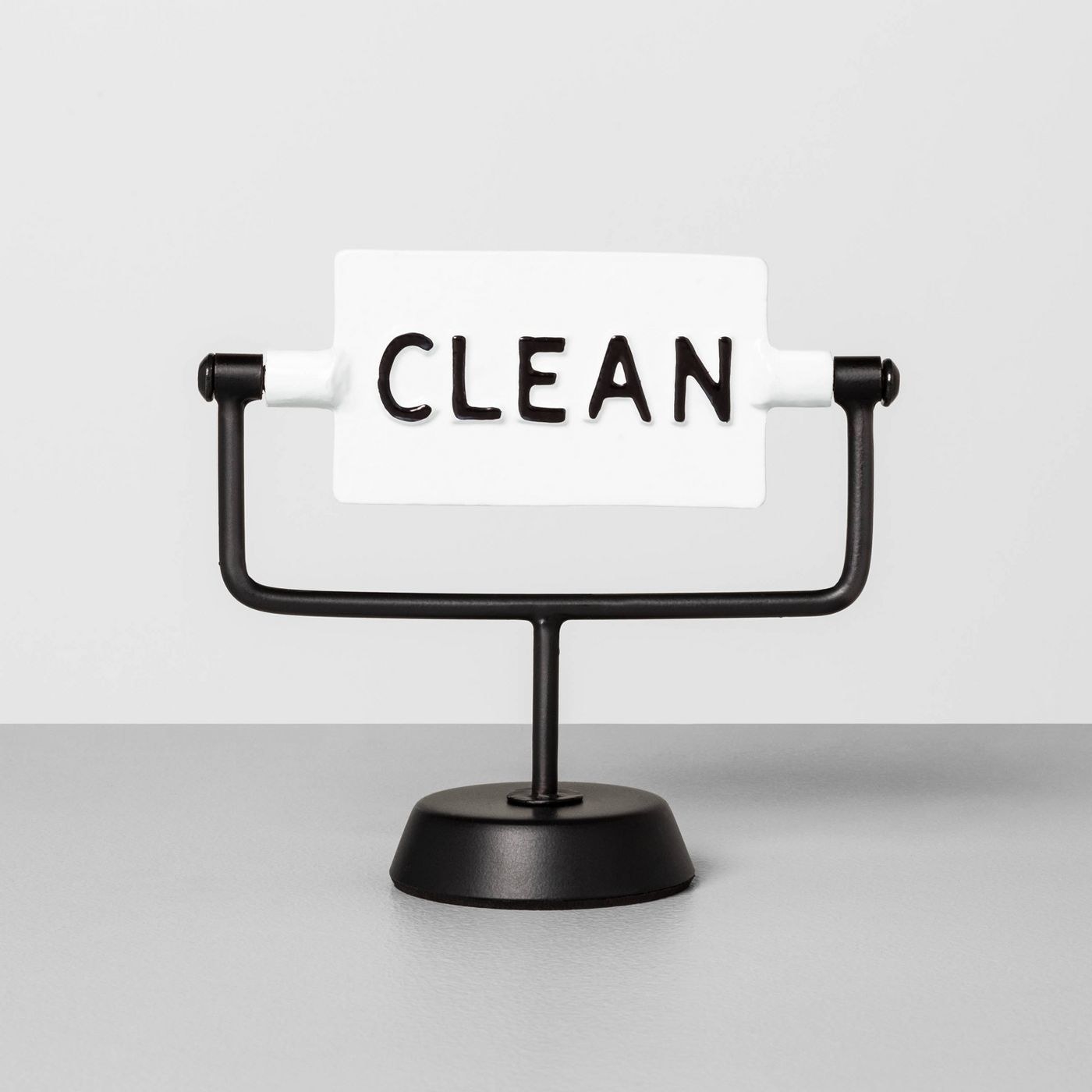 A black and white, clean/dirty sign