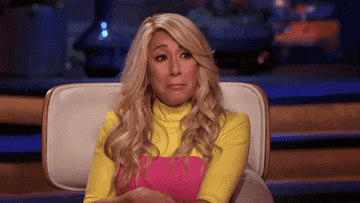 Lori Greiner holds back tears and nods her head on Shark Tank