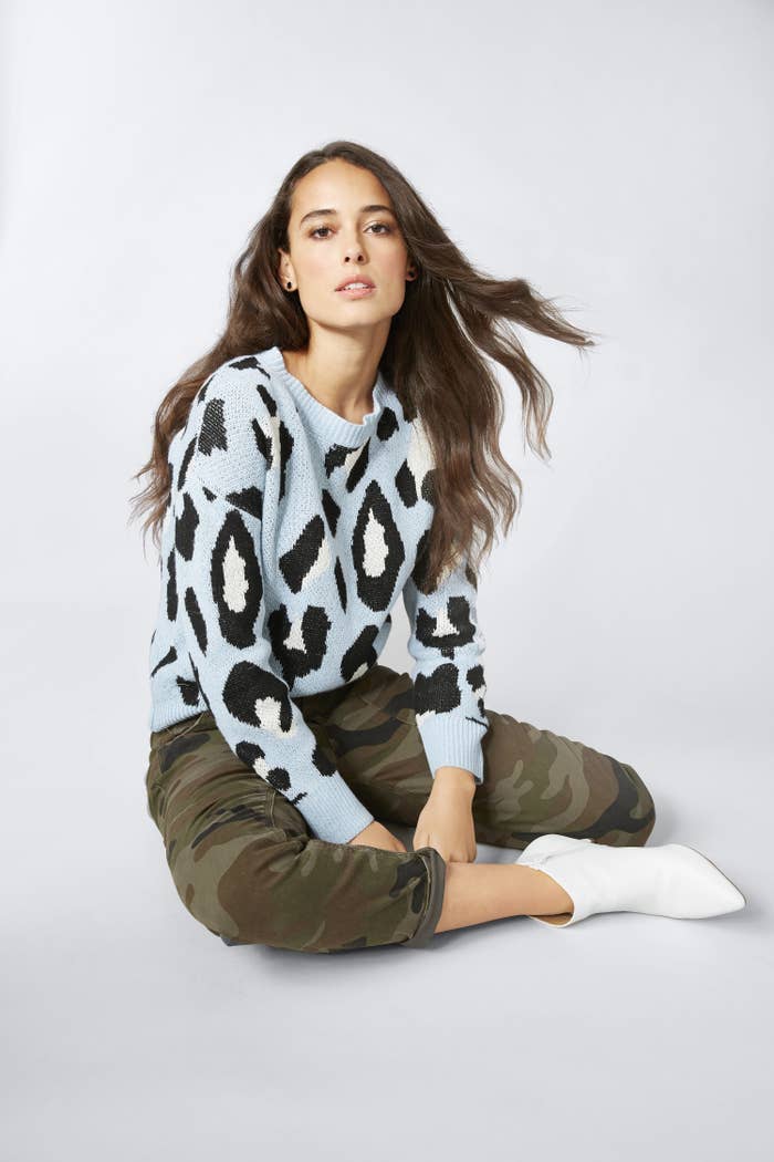 A model wearing the blue leopard sweater