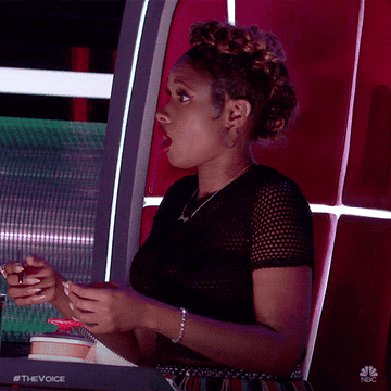 Jennifer Hudson turning around in shock, with her mouth open, on The Voice