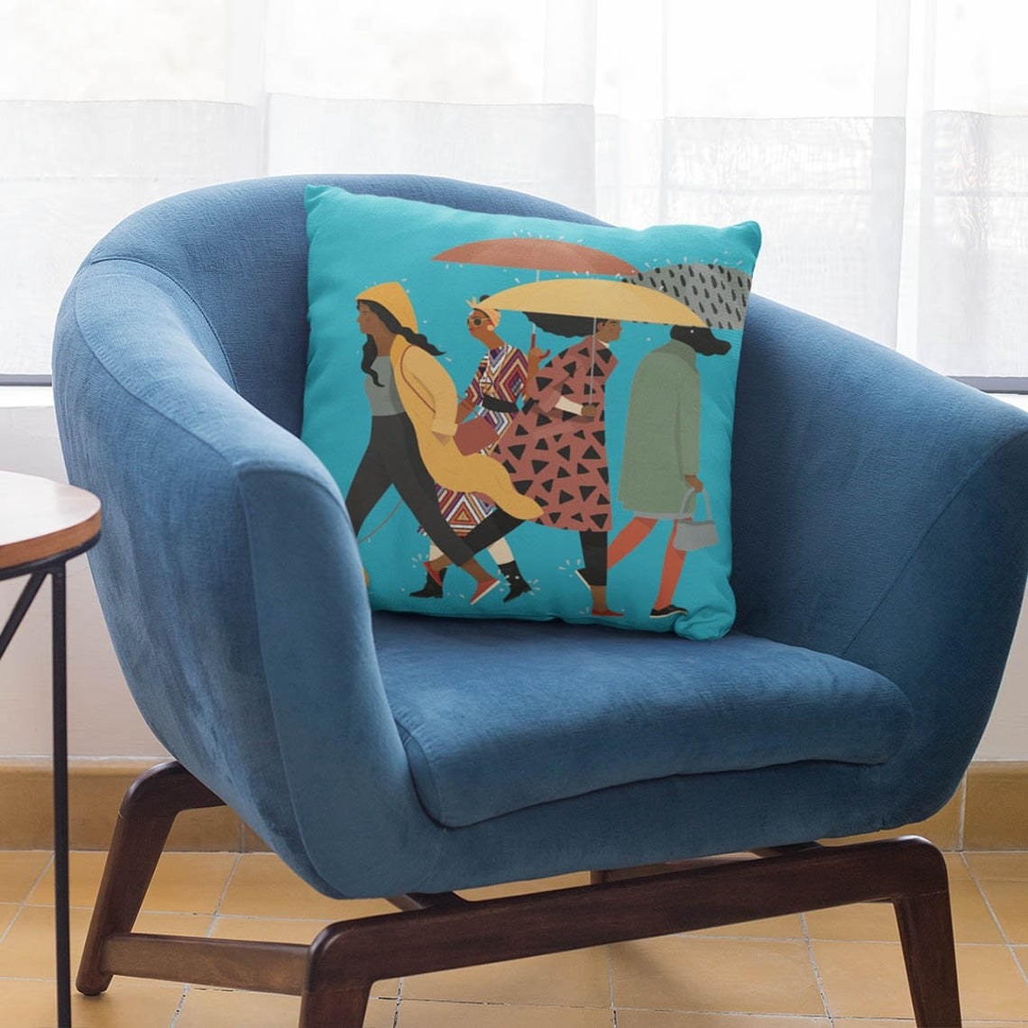 Square throw pillow with illustration of women in the rain 