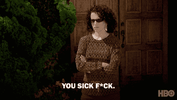 Susie Greene stands with her arms crossed and sunglasses on as she says, &quot;You sick f*ck!&quot; on Curb Your Enthusiasm