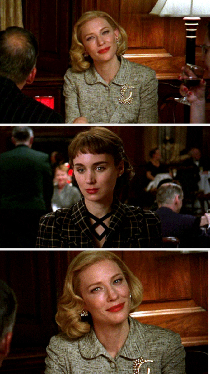 Carol and Therese staring deeply at each other at the restaurant