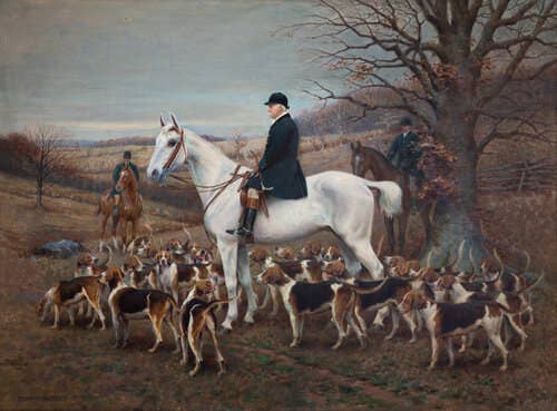 A cool toned portrait of a well-dressed man sitting astride a white horse outside with 30 hunting dogs beneath his feet.