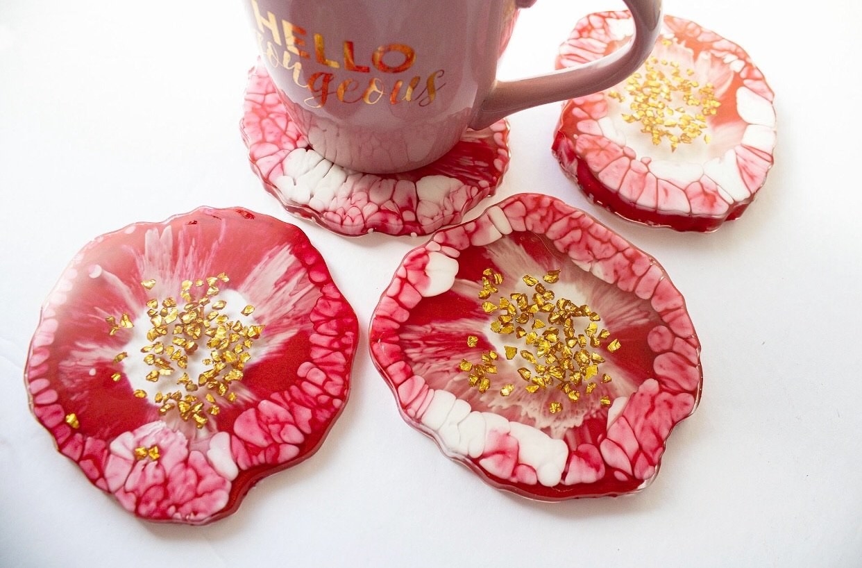 the circular resin coasters in red with good specks in the middle