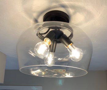 Dirty light fixture with three bulbs