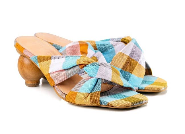 the mules with circular heel and yellow, blue, and white plaid cross-top mules