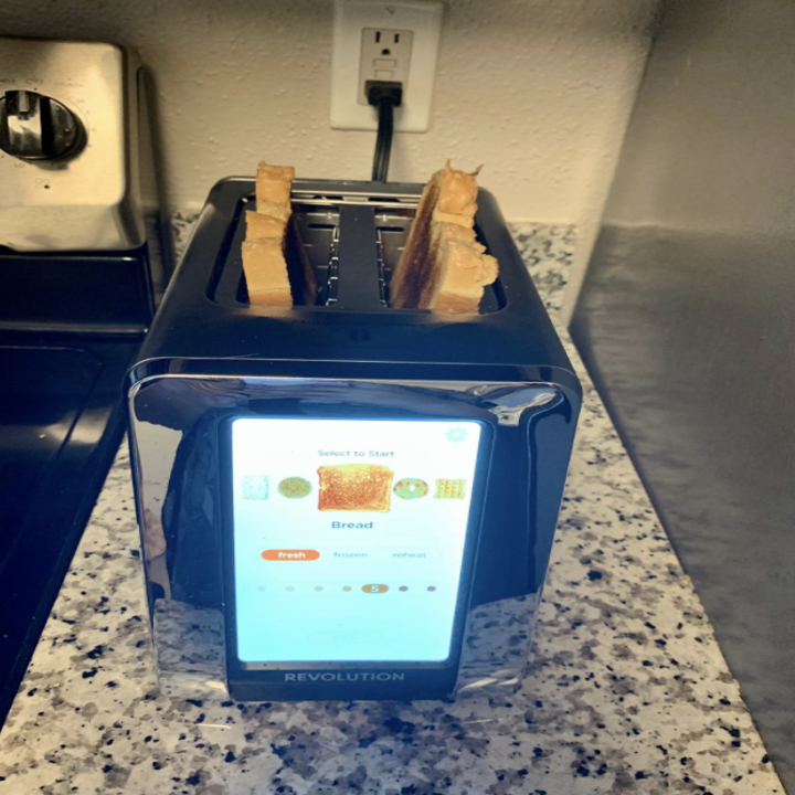 reviewer photo of toaster toasting bread 