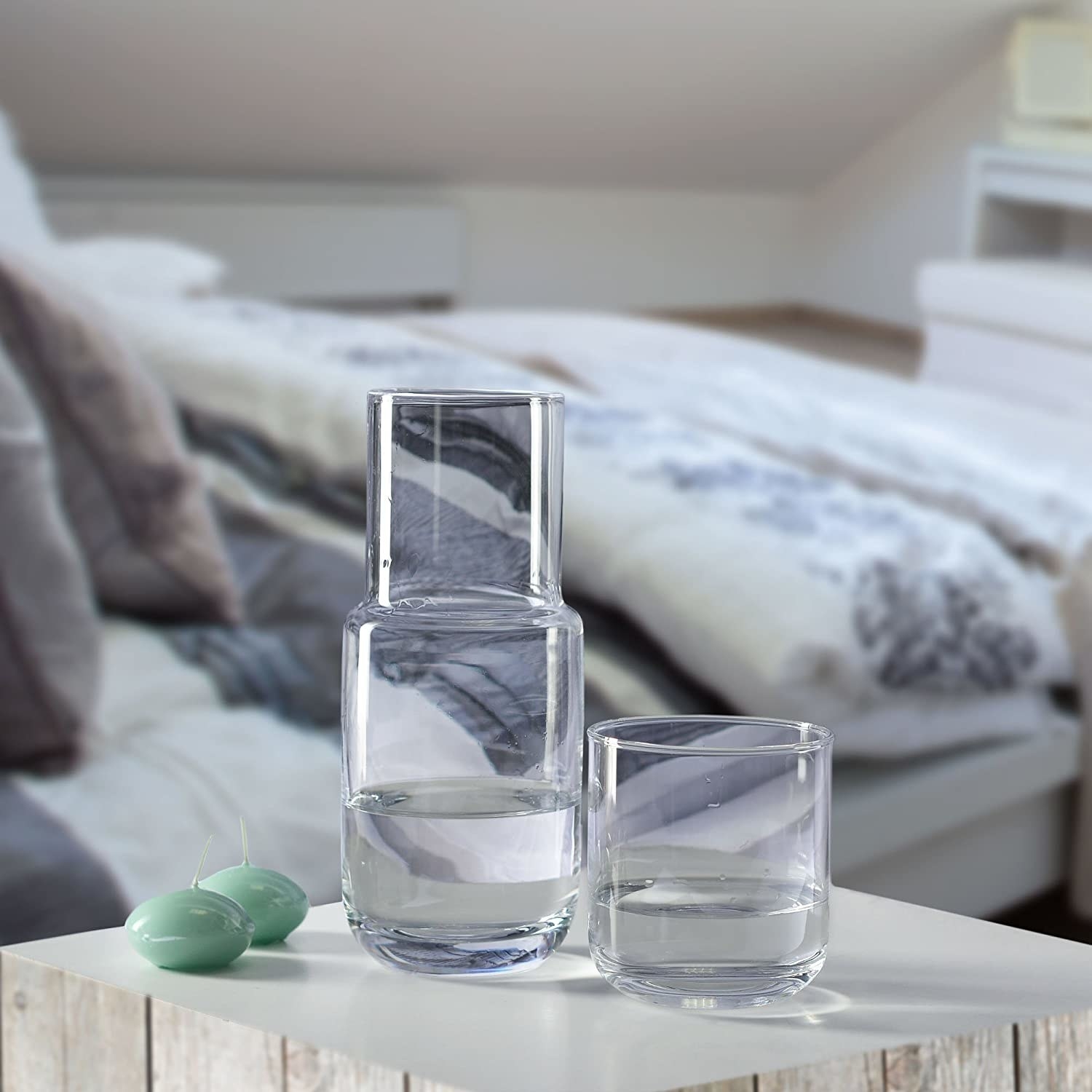 Clear bedside carafe on table 