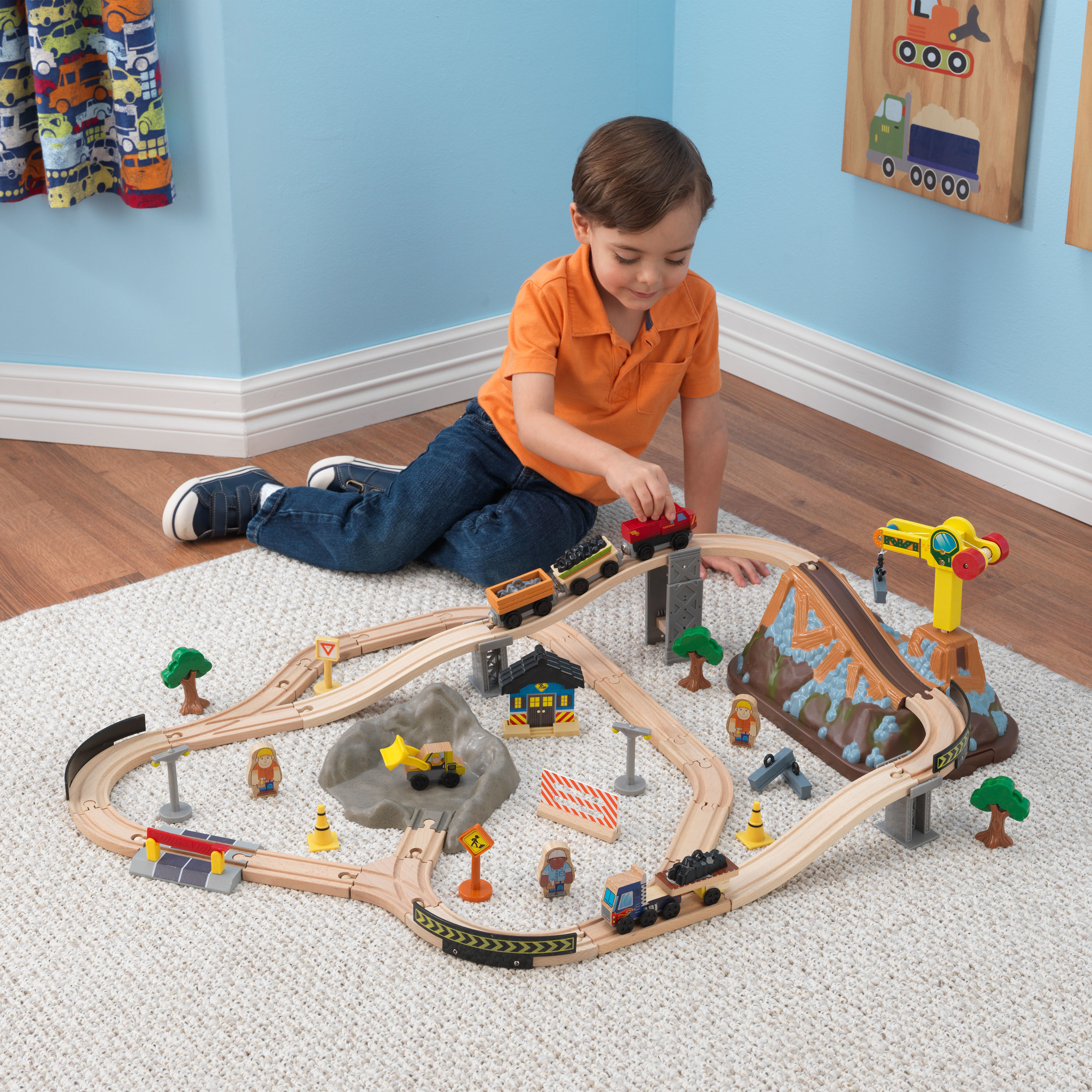 A child playing with the train set