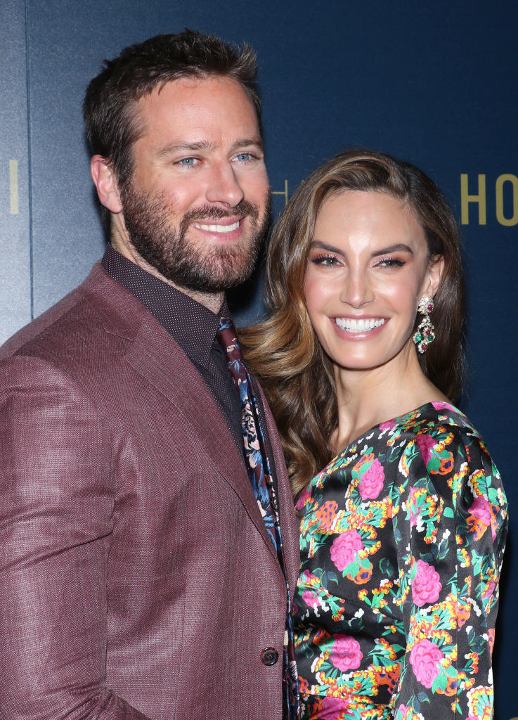 Armie and Elizabeth smile as they pose together