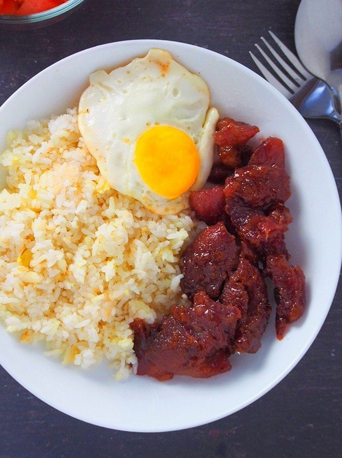 Tocino plated with rice and a fried egg