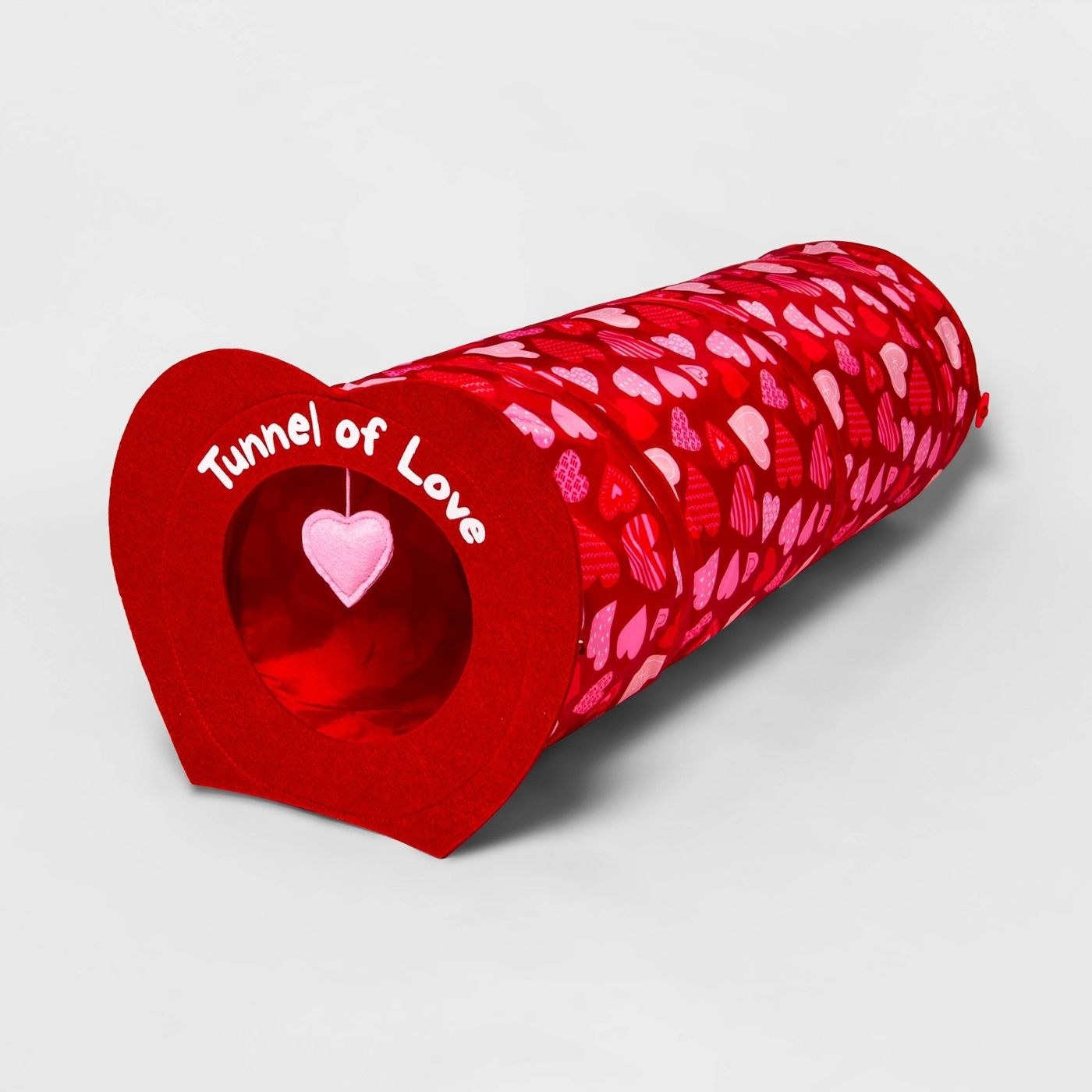 The tunnel, which has a heart-shaped opening, and a foldable heart-print tube