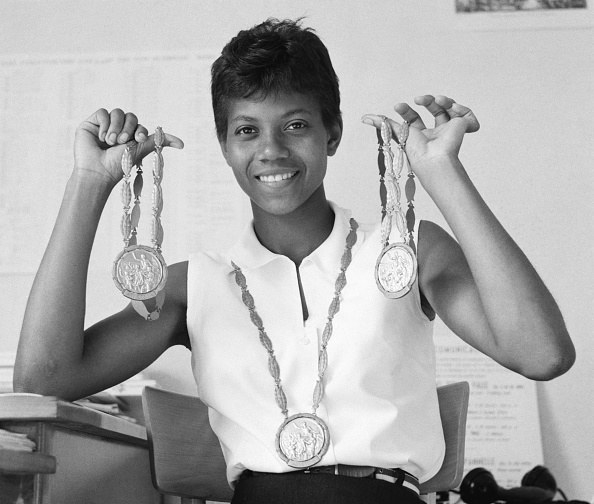 Wilma Rudolph holding medals